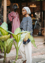 blue pattern blouse and cream trousers - Image 2